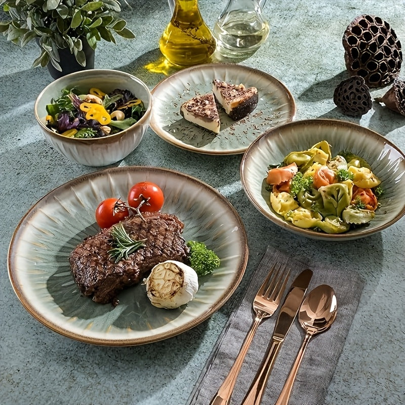 Dinner table setting with plates of food, including a steak, salad, and pasta, on a textured surface.